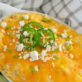cheesy buffalo chicken dip with jalapenos and blue cheese crumbles