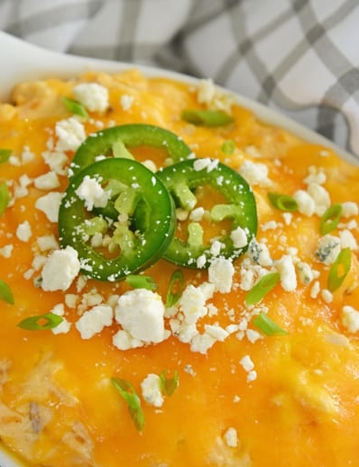 cheesy buffalo chicken dip with jalapenos and blue cheese crumbles