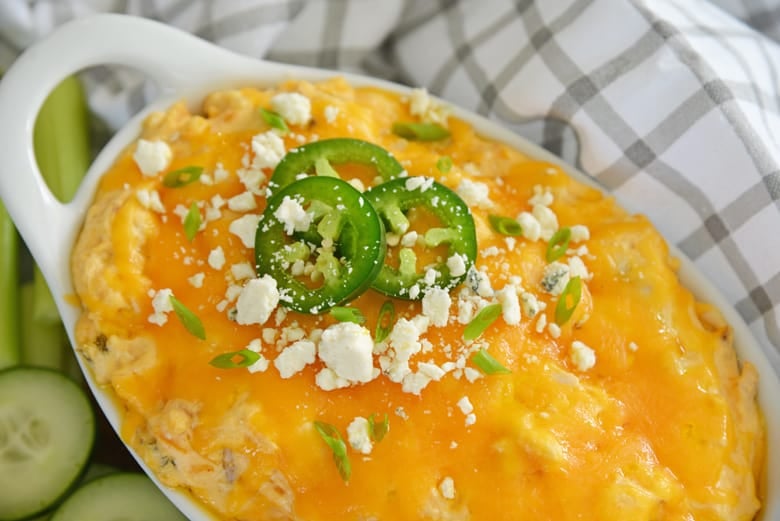 cheesy buffalo chicken dip with jalapenos and blue cheese crumbles 