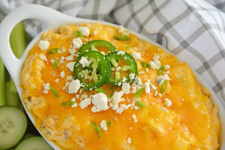 cheesy buffalo chicken dip with jalapenos and blue cheese crumbles