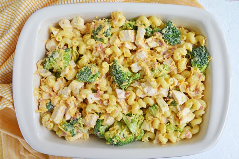 chicken and broccoli ingredients in a casserole dish  