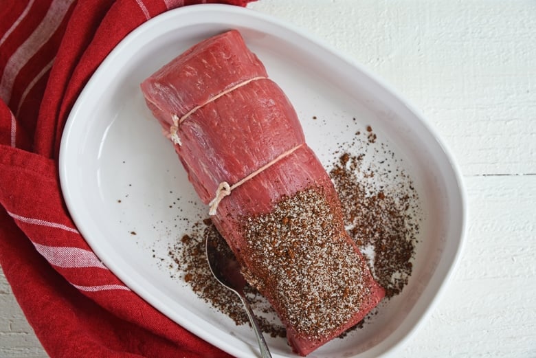 tied beef tenderloin in spice mix 