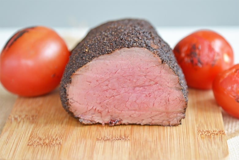 cross sectional view of a beef tenderloin cooked to medium rare