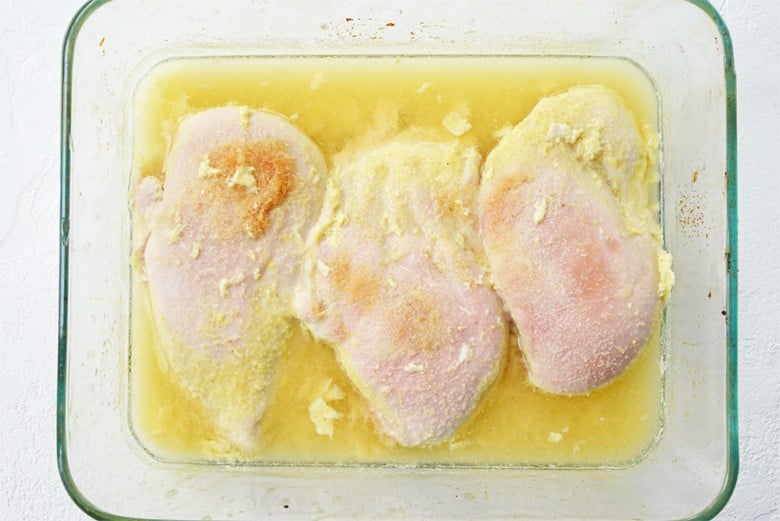 chicken cooked with chicken broth in a baking dish 