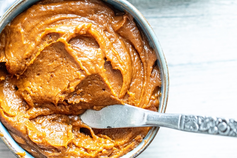 cookie butter in a bowl with a serving knife 