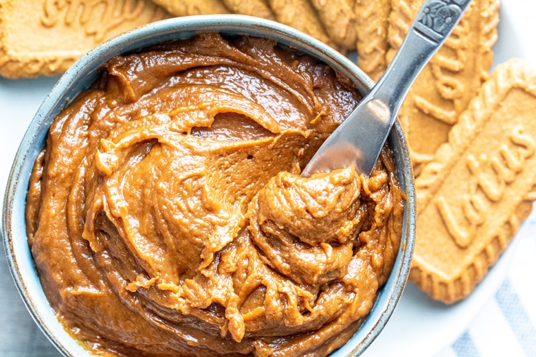 knife stirring cookie butter in a serving bowl 