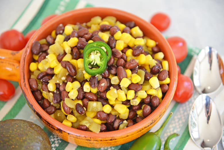 orange bowl of corn and bean salad 