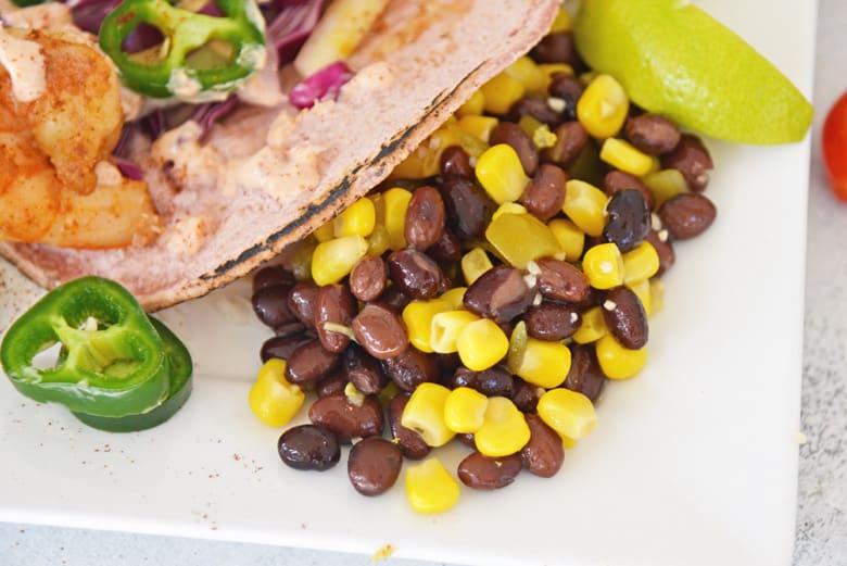 black bean salad served as a side dish to shrimp tacos 