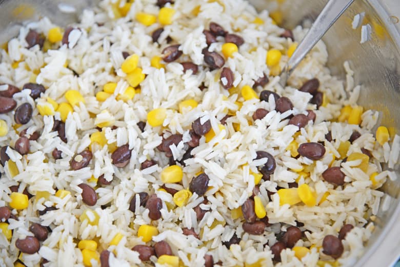 Mexican rice in a saucepan with a spoon 