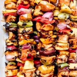 chicken skewers in a baking dish