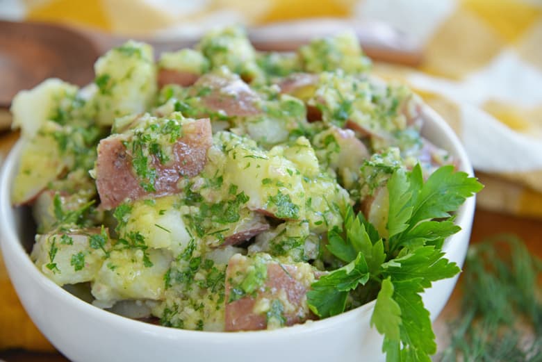 angle view of potato salad dressed with cold herb dressing 