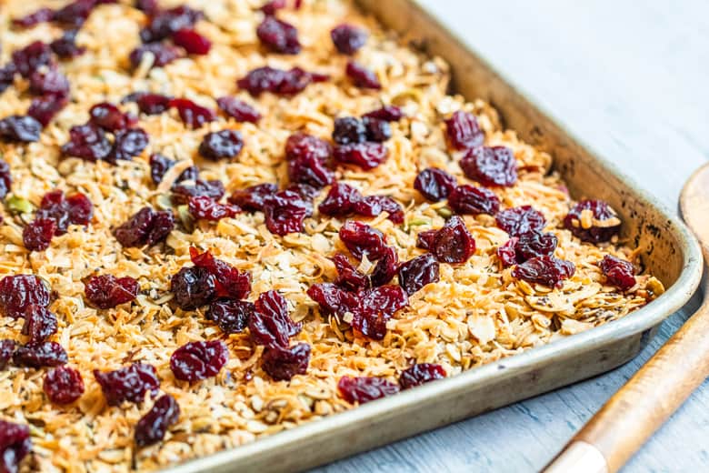 granola before baking on a rimmed baking sheet  