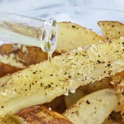truffle oil pouring onto truffle fries
