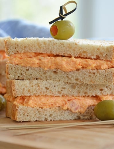 pimento cheese sandwich on wheat bread with olives