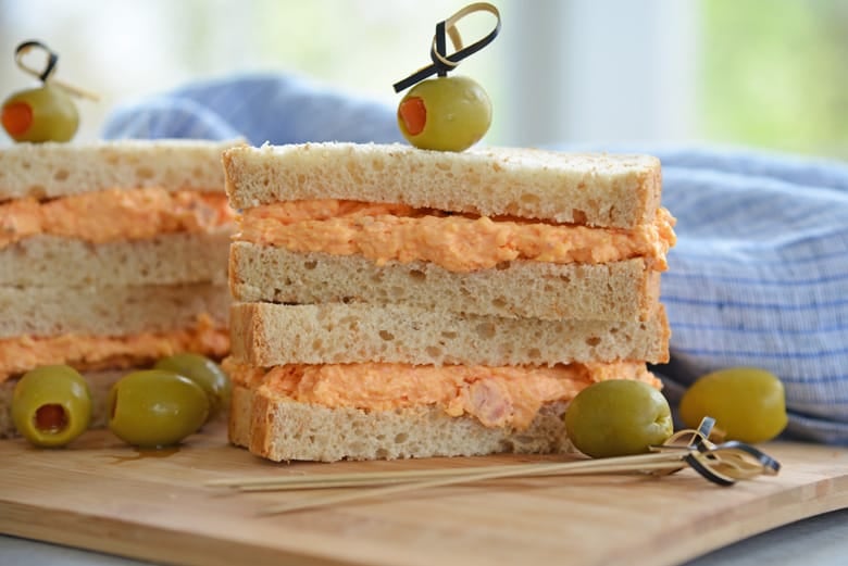 pimento cheese sandwich on wheat bread with olives