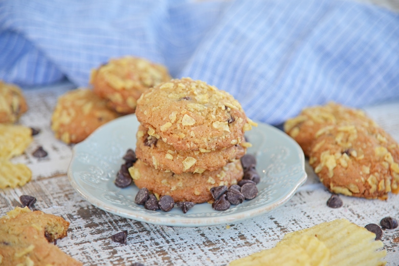 three potato chip chocolate chip cookies on a serving plate 