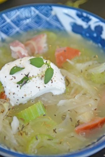 bowl of Sauerkraut Soup with sour cream garnish