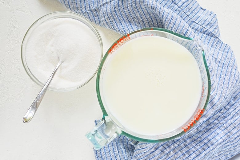 ingredients for sweetened condensed milk- sugar and milk 