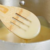 A spoon coated with sweetened condensed milk