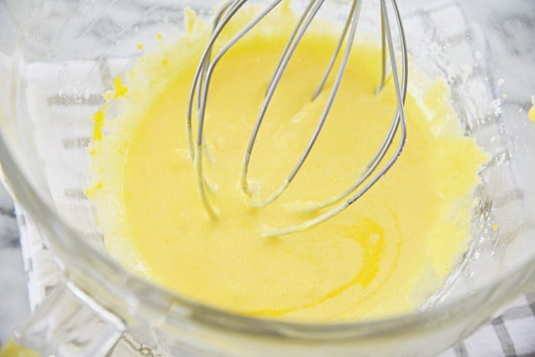 how to make vanilla custard- whisking egg yolks and sugar 