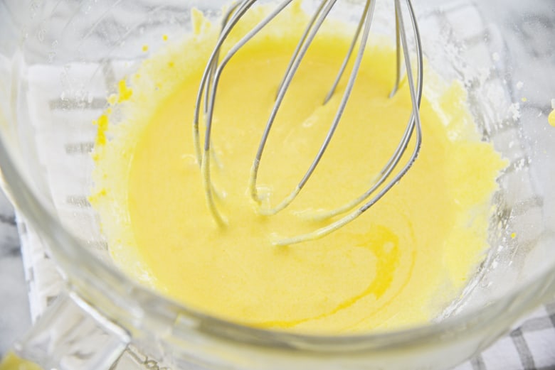 how to make vanilla custard- whisking egg yolks and sugar