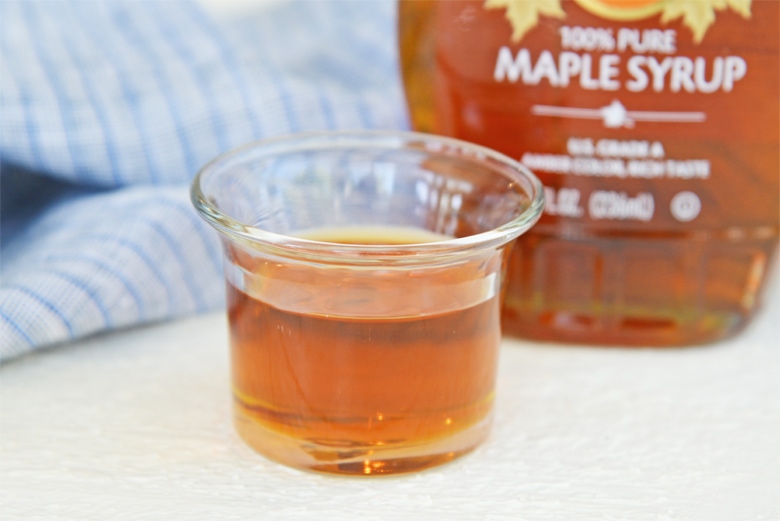 maple syrup in a small cup 