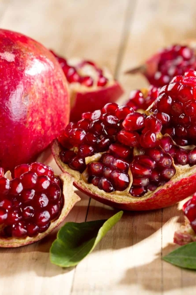 Pomegranate cut open with seeds coming out