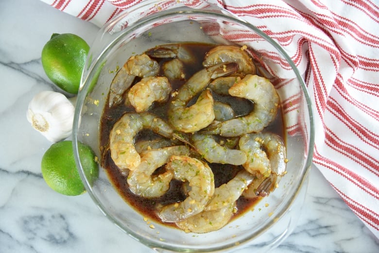 shrimp marinating in a glass bowl 