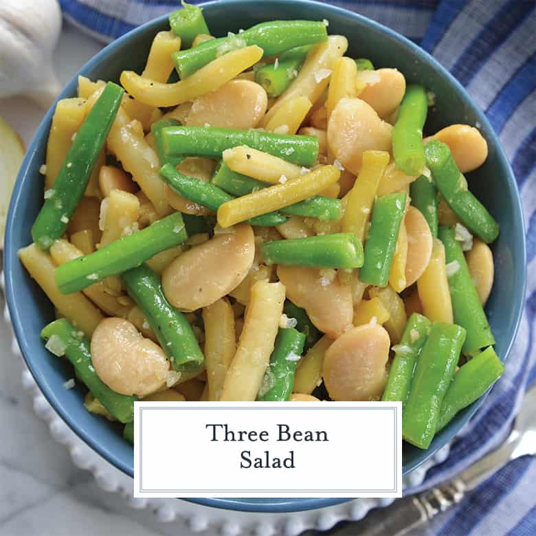 close up of three bean salad in a blue serving bowl 