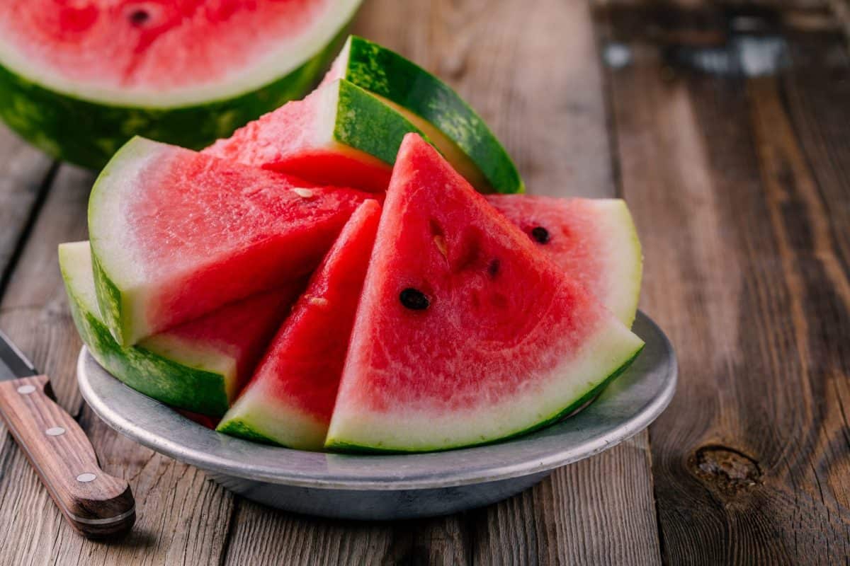 sliced watermelon on a silver plate