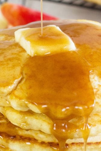 close up of apple cider syrup on pancakes