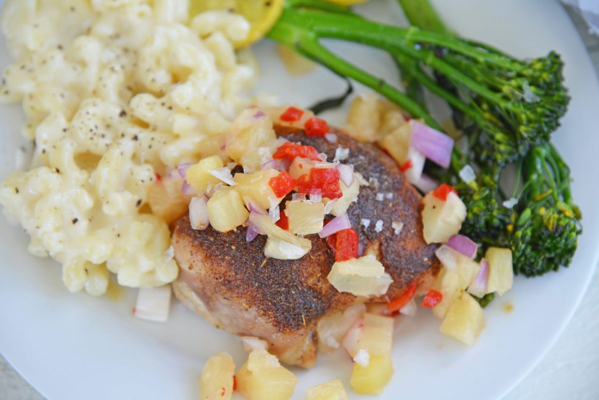 blackened chicken thighs topped with pineapple salsa 