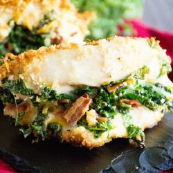 close up of kale stuffed chicken on a platter