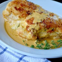 creamy stuffed chicken on a plate