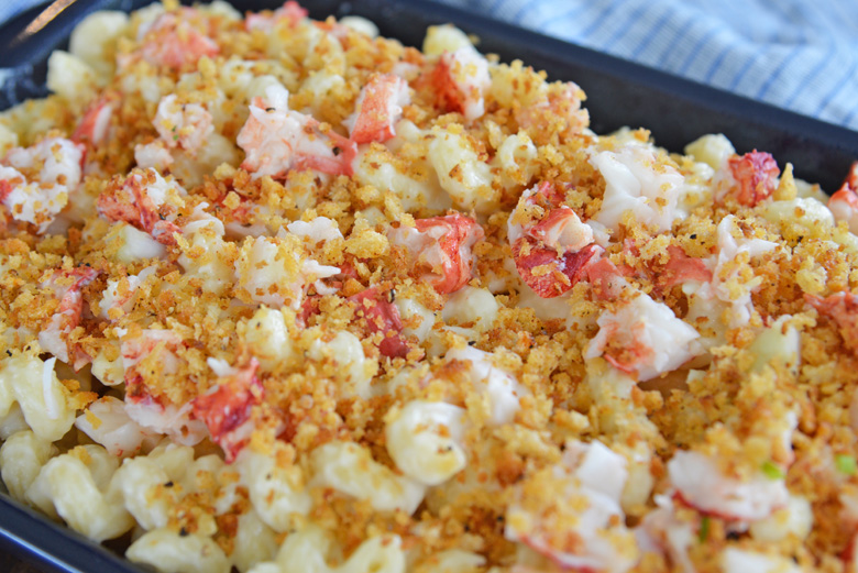 close up of lobster mac and cheese in a blue casserole dish 
