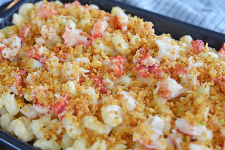 close up of lobster mac and cheese in a blue casserole dish
