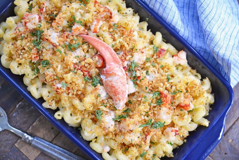 overhead of lobster mac and cheese with large piece of lobster meat on top 
