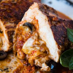 sun dried tomato pesto stuffed chicken cut in half