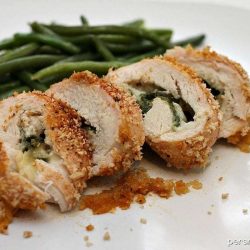 sliced spinach stuffed chicken on a plate