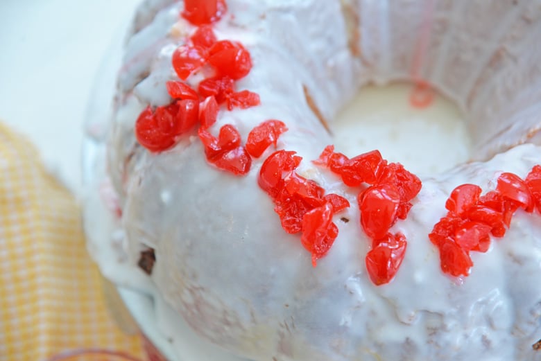angle of 7 up pound cake with chopped cherries  