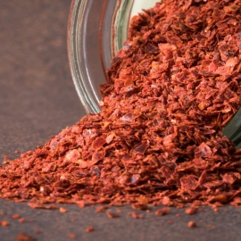 close up of aleppo pepper in a jar