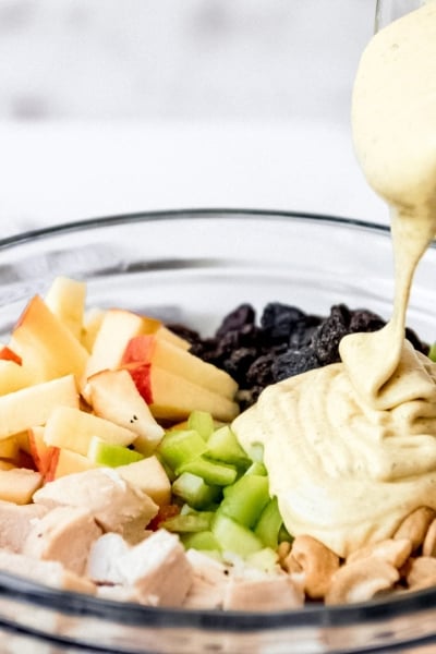 dressing pouring onto salad