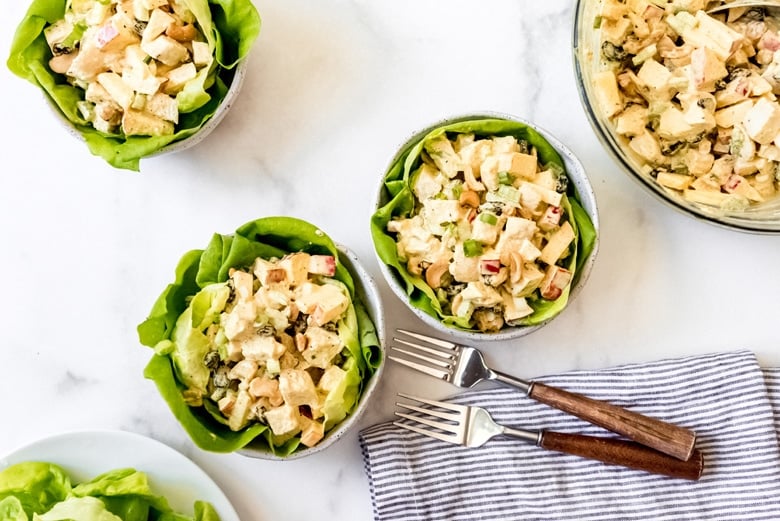 bowls of curry chicken on a table