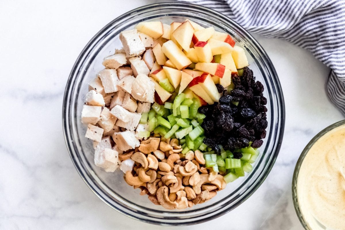 curry chicken salad ingredients in a mixing bowl 