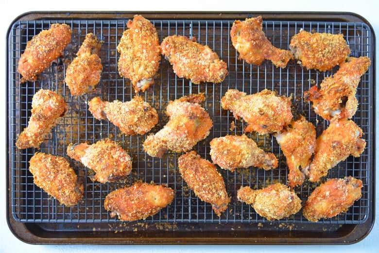 baking sheet of crispy baked buffalo wings  