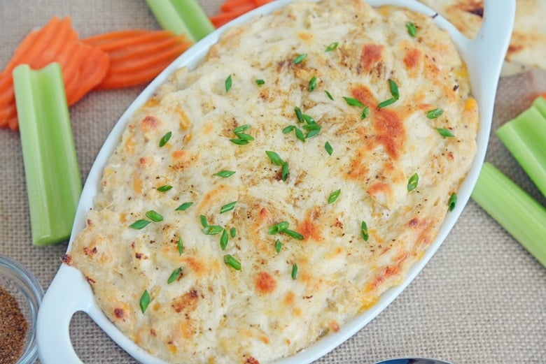 overhead of crab dip with celery and carrots 