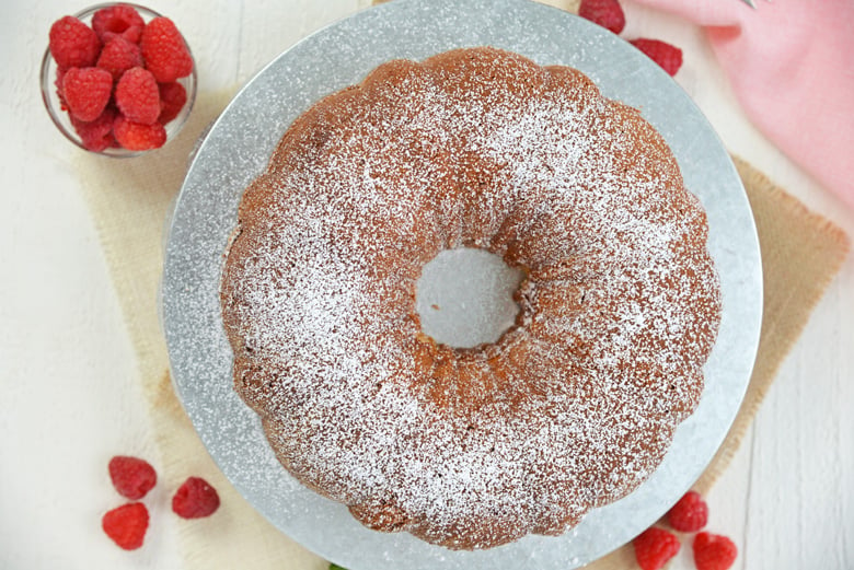 overhead of sour cream pound cake with powdered sugar dusting