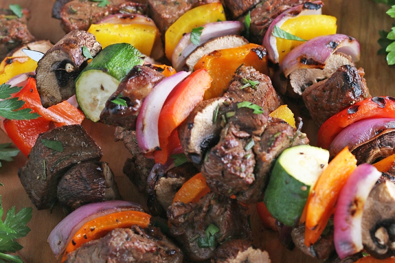 close up of steak kabobs with veggies