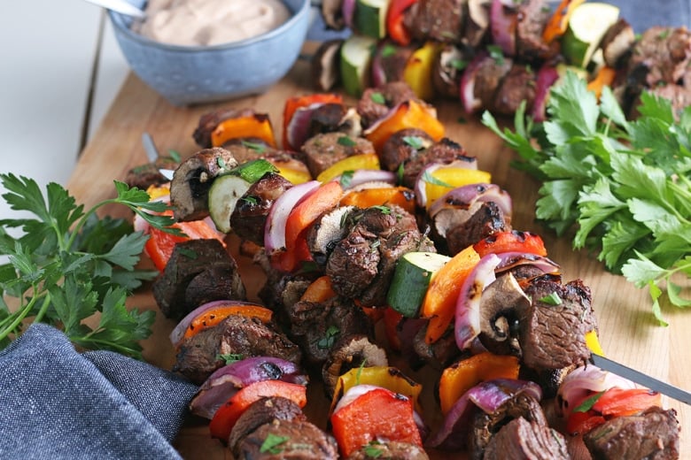 angle view of steak kabobs with vegetables 