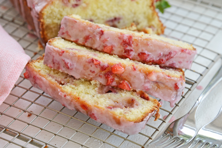 strawberry pound cake slices on a cooling rack 